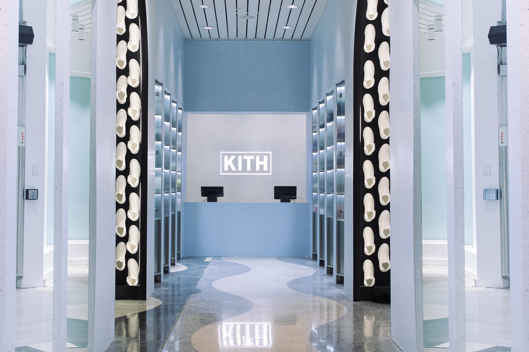 Kith Miami Beach interior with the Kith logo, central counter, and arched architecture
